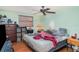 Bedroom with ceiling fan, a window with blinds, and assorted furniture and decor at 3921 Marlborough Pl, Sarasota, FL 34241
