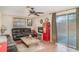 Cozy living room features unique decor, a fireplace, and sliding glass doors to the outdoor space at 3921 Marlborough Pl, Sarasota, FL 34241