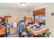 Cluttered room with boxes and assorted items, showcasing storage space at 3921 Marlborough Pl, Sarasota, FL 34241