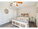A serene bedroom featuring a ceiling fan, wooden floors, closet, and nice decorations at 4061 Crockers Lake Blvd # 27, Sarasota, FL 34238