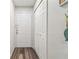 Bright entryway featuring wood-look floors, storage closet, and neutral wall paint at 4061 Crockers Lake Blvd # 27, Sarasota, FL 34238