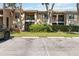 Inviting condo exterior with well-maintained landscaping, balconies, and assigned parking spaces at 4061 Crockers Lake Blvd # 27, Sarasota, FL 34238