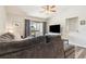 Inviting living room featuring ceiling fan, comfortable seating, and sliding door access to balcony at 4061 Crockers Lake Blvd # 27, Sarasota, FL 34238