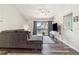 Comfortable living room with contemporary furnishings, wood flooring, and natural light at 4061 Crockers Lake Blvd # 27, Sarasota, FL 34238