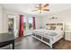 Bright main bedroom featuring a large window, stylish furniture, and a comfortable king-size bed at 4061 Crockers Lake Blvd # 27, Sarasota, FL 34238