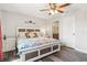 Cozy main bedroom with a queen-size bed, bedside tables, decorative touches, and ensuite bathroom at 4061 Crockers Lake Blvd # 27, Sarasota, FL 34238