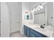 Charming bathroom with updated vanity, sink, and lighting fixtures at 4307 Manfield Dr, Venice, FL 34293