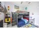 Bright bedroom featuring a bunk bed, gaming decor, and playful color accents at 4307 Manfield Dr, Venice, FL 34293