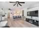 Open concept living room with breakfast bar seating and wood look floors at 4307 Manfield Dr, Venice, FL 34293