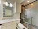 Modern bathroom features a walk-in shower, granite vanity and updated fixtures at 4647 Stone Ridge Trl, Sarasota, FL 34232
