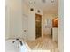 Bathroom featuring tub, tiled shower, and natural light at 4647 Stone Ridge Trl, Sarasota, FL 34232