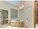 Bathroom featuring tub, tile floors, and a tiled shower enclosure at 4647 Stone Ridge Trl, Sarasota, FL 34232