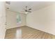 Spacious empty bedroom features modern flooring, trim and a ceiling fan at 4647 Stone Ridge Trl, Sarasota, FL 34232