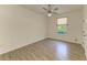 Spacious empty bedroom features modern flooring, trim and a ceiling fan at 4647 Stone Ridge Trl, Sarasota, FL 34232