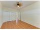 Comfortable bedroom with tile flooring, a ceiling fan, and a closet at 4647 Stone Ridge Trl, Sarasota, FL 34232