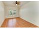 Cozy bedroom with tile flooring, a ceiling fan, and a bright window at 4647 Stone Ridge Trl, Sarasota, FL 34232