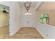 Spacious foyer features double front doors, a chandelier, and tile floors at 4647 Stone Ridge Trl, Sarasota, FL 34232