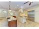 Open kitchen with large island and stainless steel appliances at 4647 Stone Ridge Trl, Sarasota, FL 34232