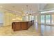 Spacious kitchen with a large island, custom cabinets, and modern appliances at 4647 Stone Ridge Trl, Sarasota, FL 34232