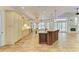 Well-appointed kitchen features custom cabinets, granite countertops and island seating at 4647 Stone Ridge Trl, Sarasota, FL 34232