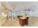 The home chef will enjoy this kitchen with large island and stainless steel appliances at 4647 Stone Ridge Trl, Sarasota, FL 34232