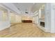 Spacious living room with fireplace, tiled floors, high ceiling and open plan design at 4647 Stone Ridge Trl, Sarasota, FL 34232