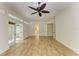 Expansive living area featuring tile floors, French doors, and plenty of natural light at 4647 Stone Ridge Trl, Sarasota, FL 34232
