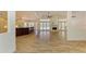 Open-concept living space with tile floors, a fireplace, and views of the outdoors at 4647 Stone Ridge Trl, Sarasota, FL 34232