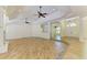 Large living space with an open layout, ceiling fans, and tile flooring at 4647 Stone Ridge Trl, Sarasota, FL 34232