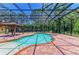 Inviting in-ground pool featuring an adjacent gazebo and brick-paved patio at 4647 Stone Ridge Trl, Sarasota, FL 34232