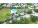 Aerial view showcasing community amenities: pool, playground, tennis and basketball courts at 4727 Sabal Key Dr # 4727, Bradenton, FL 34203