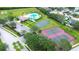 Overhead view of community pool, basketball and tennis courts with lush landscaping at 4727 Sabal Key Dr # 4727, Bradenton, FL 34203