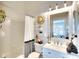 Well-lit bathroom with a shower/tub combo, stylish mirror, and vanity at 4727 Sabal Key Dr # 4727, Bradenton, FL 34203