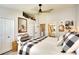 Comfortable bedroom showcasing a view to bathroom, light gray wood floors, and decor accents at 4727 Sabal Key Dr # 4727, Bradenton, FL 34203
