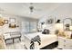Bright bedroom with a ceiling fan, plantation shutters, and a bench at 4727 Sabal Key Dr # 4727, Bradenton, FL 34203