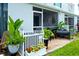 Exterior view of a home with a screened-in patio, pretty plants, and a well-maintained backyard at 4727 Sabal Key Dr # 4727, Bradenton, FL 34203