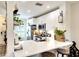 Bright kitchen with stainless steel appliances, white cabinetry, and a breakfast bar with stools at 4727 Sabal Key Dr # 4727, Bradenton, FL 34203