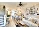 Open living space with stairs, kitchen, dining, and sitting areas, creating a cohesive living experience at 4727 Sabal Key Dr # 4727, Bradenton, FL 34203