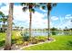 Beautiful pond view with palm trees and well-manicured landscaping at 4727 Sabal Key Dr # 4727, Bradenton, FL 34203