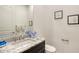 Stylish powder room features granite counters, modern fixtures, and charming wall art at 4809 Benito Ct, Bradenton, FL 34211
