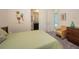 Bright bedroom with a full bed and a view to the backyard pool at 4809 Benito Ct, Bradenton, FL 34211