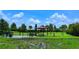 Well-maintained dog park with green grass, shade, and a fully fenced-in area at 4809 Benito Ct, Bradenton, FL 34211