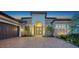 Charming home exterior showcasing a paved driveway, attached garage, and a decorative archway entrance at 4809 Benito Ct, Bradenton, FL 34211