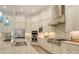 A chef's kitchen with granite countertops, stainless steel appliances, island and custom cabinets for plenty of storage at 4809 Benito Ct, Bradenton, FL 34211