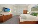Large main bedroom with a gray carpet, an area for additional seating, and access to the backyard at 4809 Benito Ct, Bradenton, FL 34211