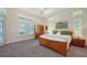 Bright bedroom with large windows providing natural light and carpet flooring throughout at 4809 Benito Ct, Bradenton, FL 34211