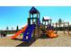 Community playground area with slides, climbing structures, and a soft landing surface at 4809 Benito Ct, Bradenton, FL 34211