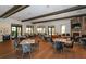Bright restaurant with tables, chairs, a fireplace, and large windows offering scenic views at 4809 Benito Ct, Bradenton, FL 34211