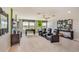 Spacious game room featuring comfortable seating, foosball table, television, and decorative wall art at 5116 Rosado Run, Lakewood Ranch, FL 34211