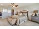 Serene main bedroom featuring neutral tones, a comfortable bed, and ample closet space at 5116 Rosado Run, Lakewood Ranch, FL 34211